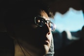 man eyes closed wearing eyeglasses