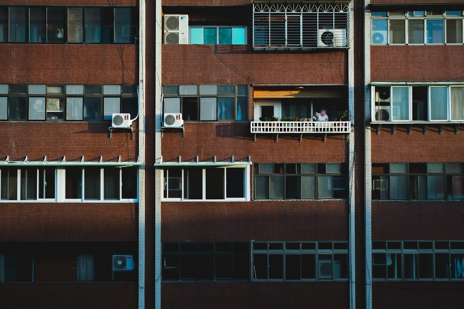 Fujifilm X-T10 + Fujifilm XF 35mm F2 R WR sample photo. Person at the balcony photography