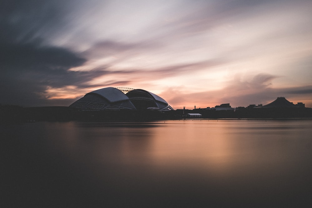 concrete building near body of water