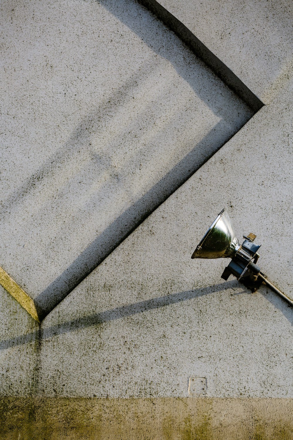 gray stainless steel lamp on gray concrete pavement