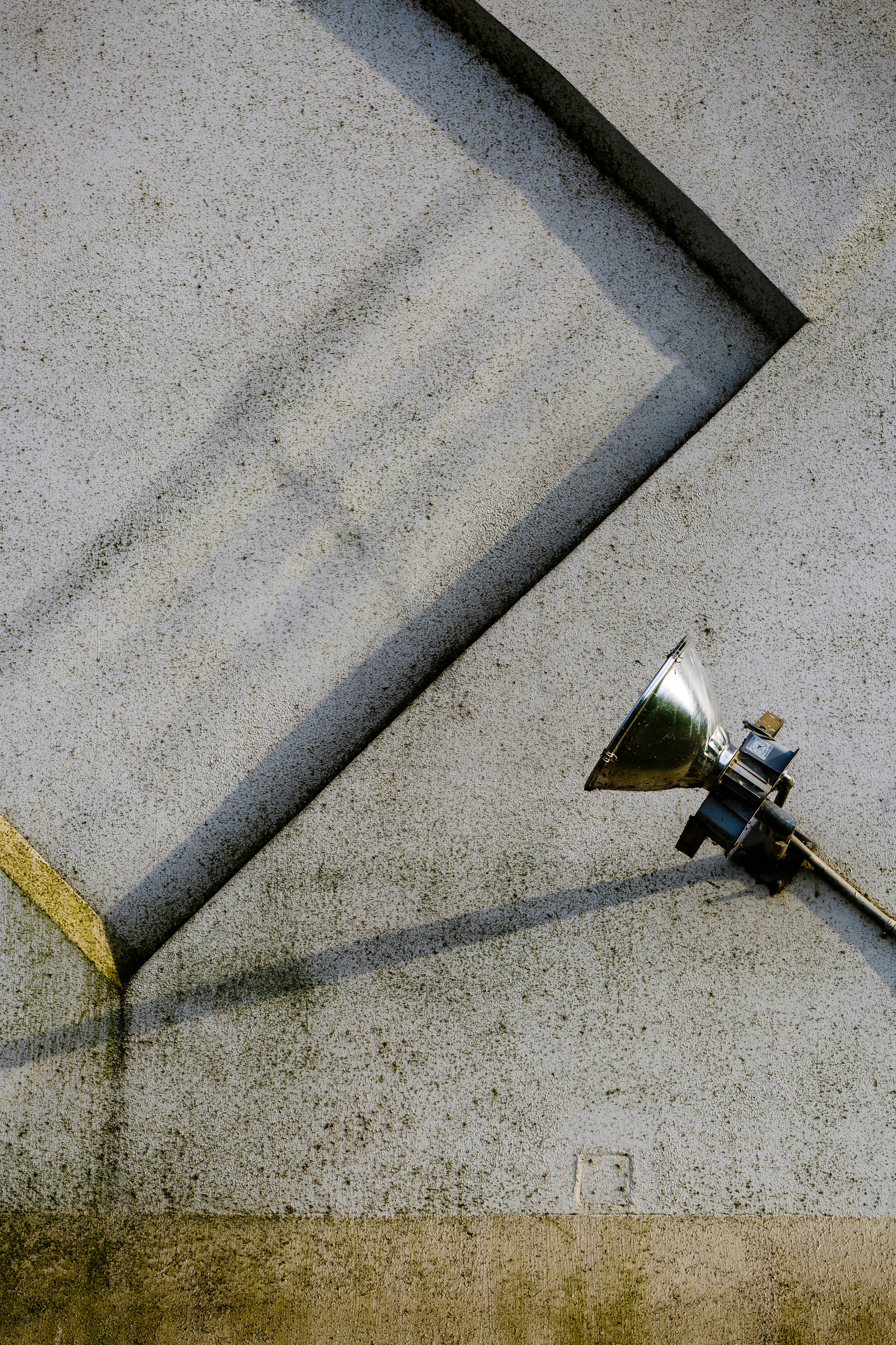 gray stainless steel lamp on gray concrete pavement