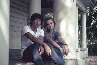 A happy couple enjoying a peaceful morning on the porch of their rented cottage.