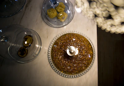 Various pastillage figures drying on a kitchen counter with natural light.