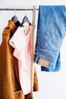 women's four assorted apparel hanged on clothes rack