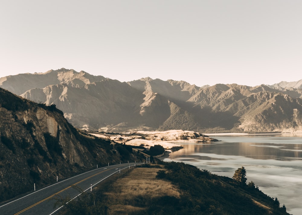 road at the foot of the mountain near lake