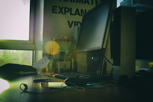 A close-up of a recruiter reviewing resumes and notes in a well-lit office space.