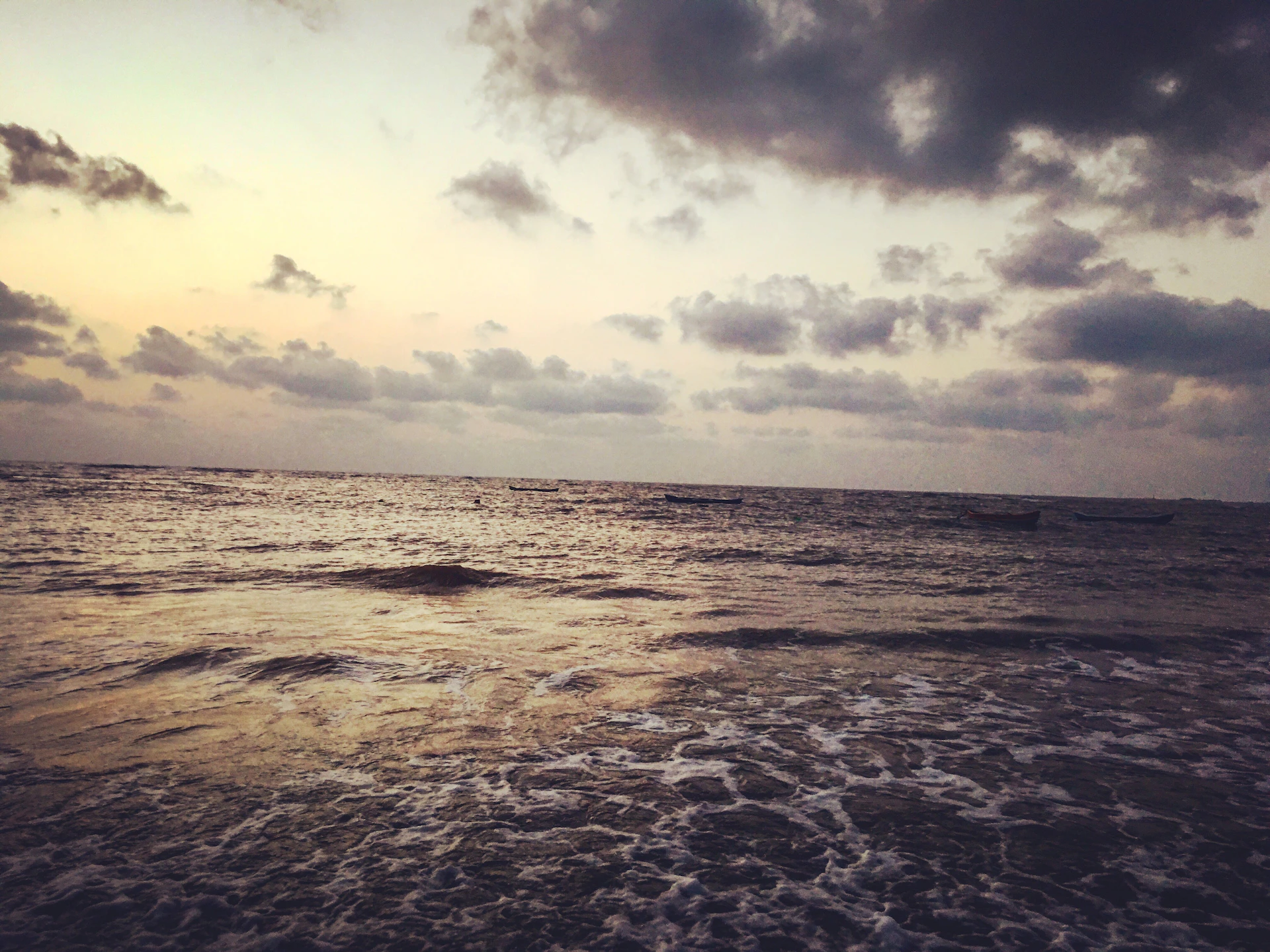 woman wearing yellow long-sleeved dress under white clouds and blue sky during daytime