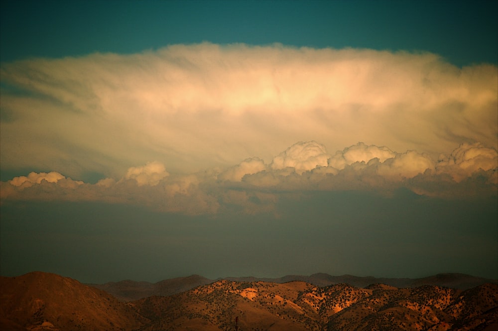 brown mountains under blue sky during daytime