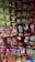 A display rack filled with various flavored snack packets, mainly chips from brands like Lay's and Kurkure, arranged in a colorful and visually appealing manner.