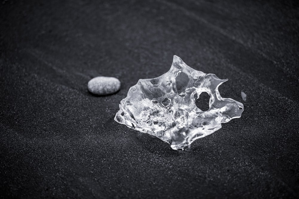 clear cut glass fragment on black surface