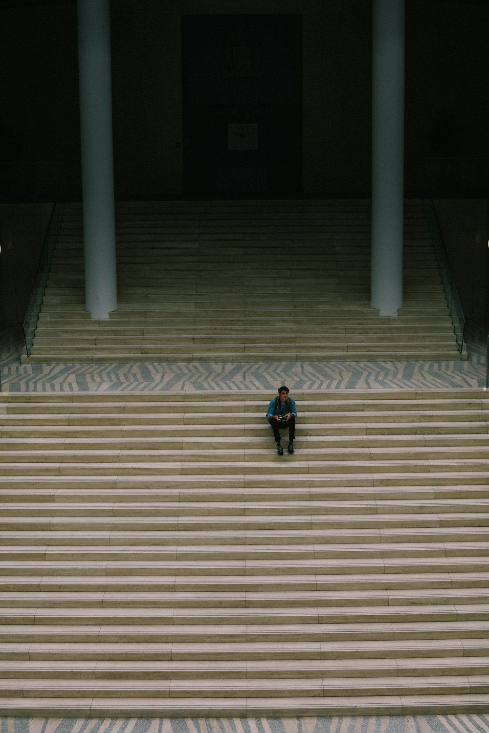 man sitting on a flight of stairs