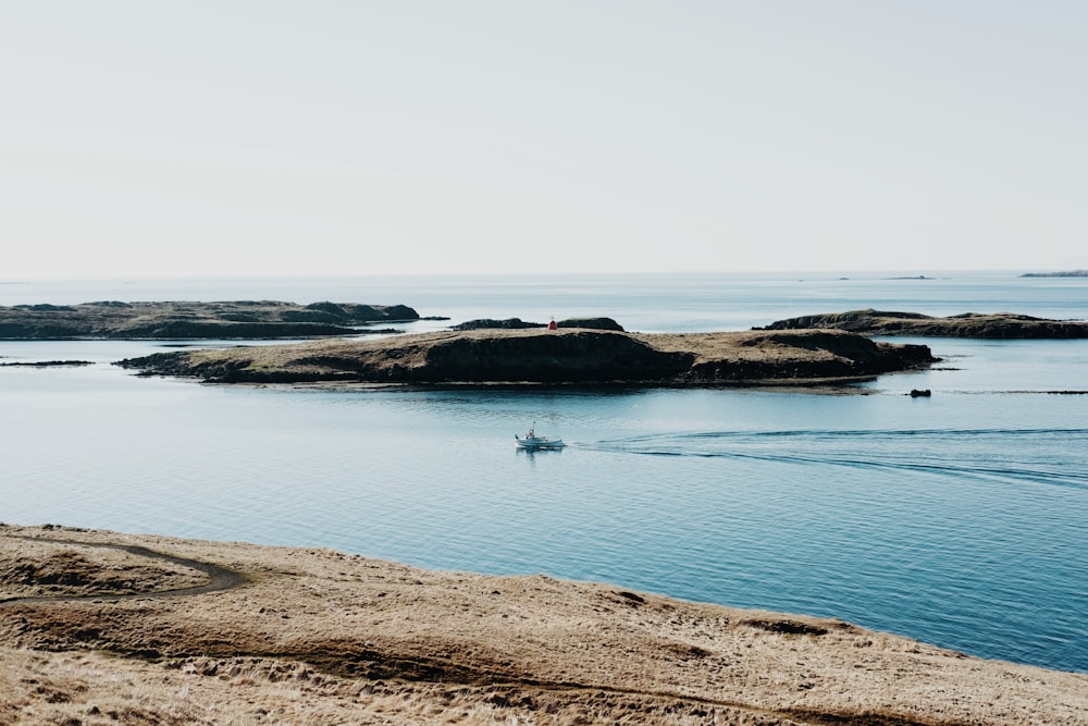 landscape photo of seashore under blue sky