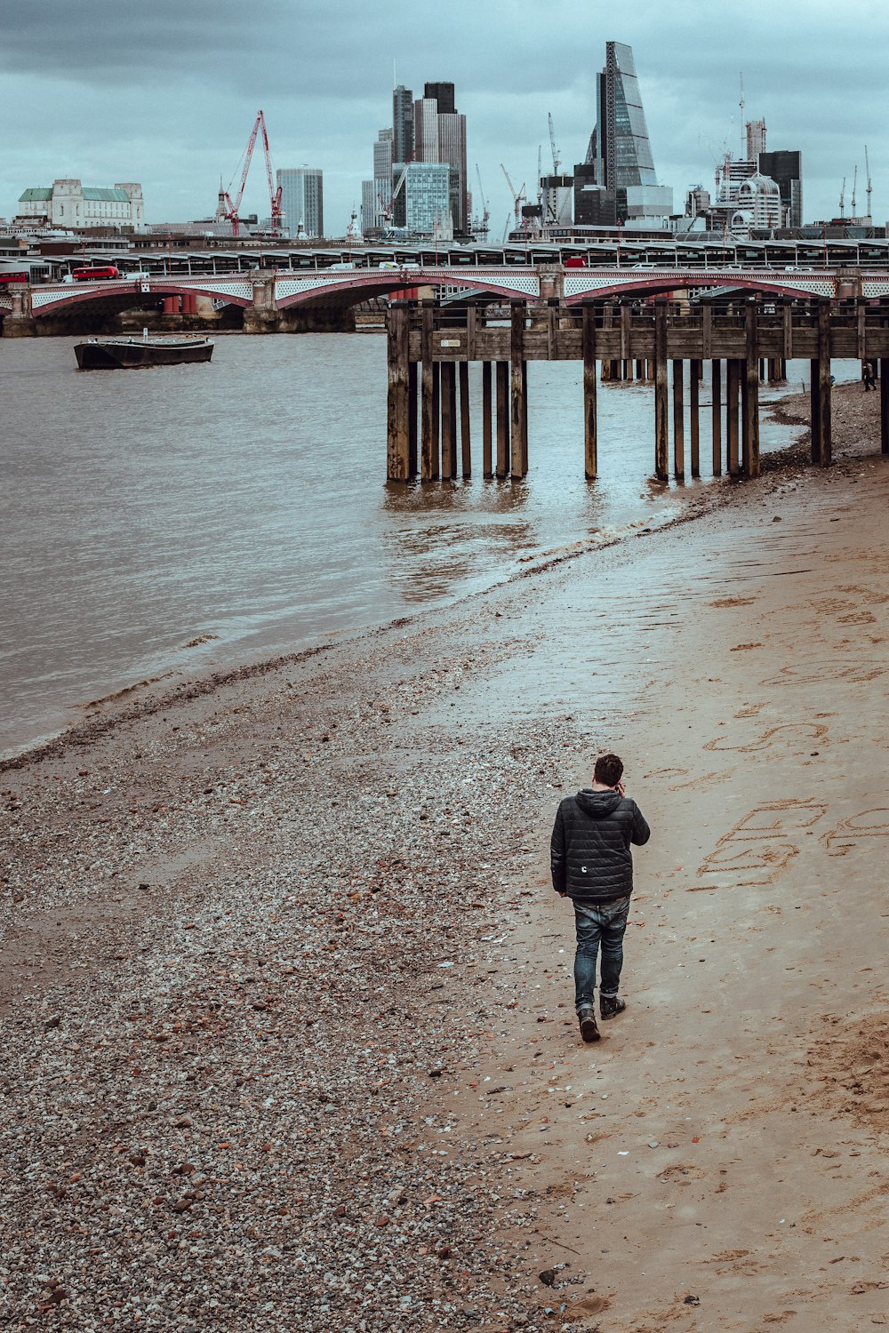 man walking on seashore