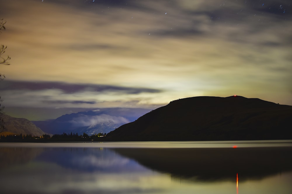 landscape photography of mountain under gloomy sky