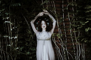 woman wearing white dress on garden