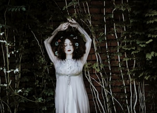 woman wearing white dress on garden