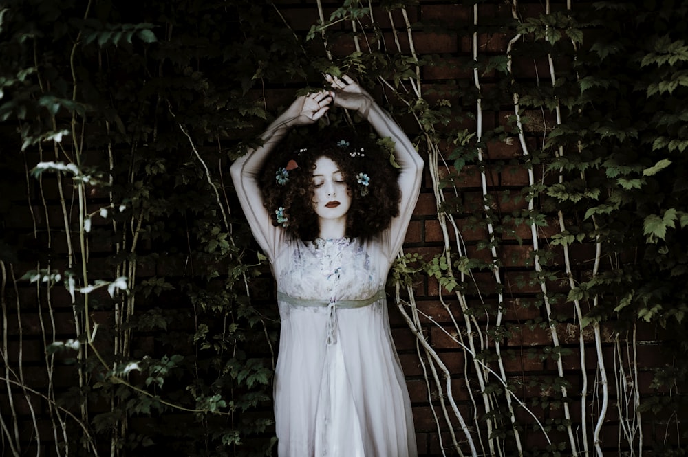 woman wearing white dress on garden