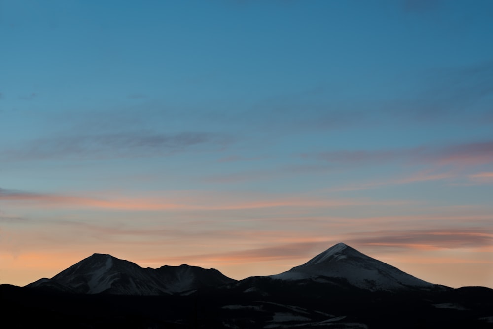 silhouette photo of mountain during daytime