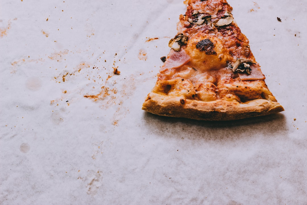 slice pizza with ham toppings, The last piece