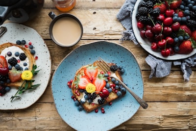 fruit sandwich on a blue ceramic plate breakfast google meet background