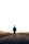 man walking along road