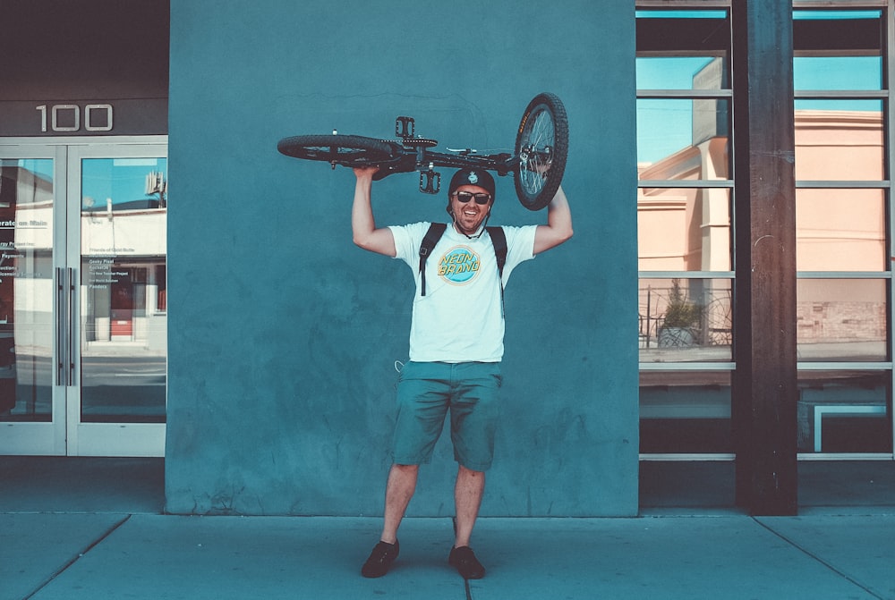 men's white crew-neck t-shirt and blue shorts