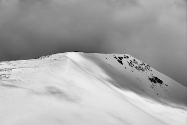 Ski mountaineers ascending a snowy peak