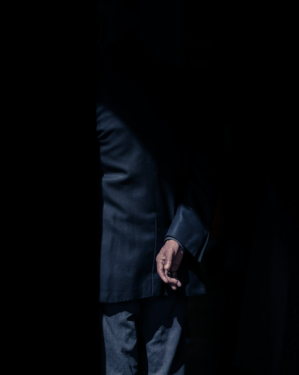 man wearing black suit jacket