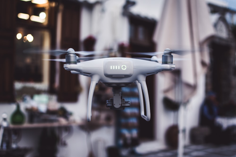 tilt shift lens photography of gray Phantom drone