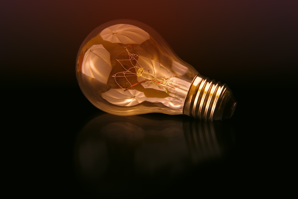 incandescent bulb on black surface