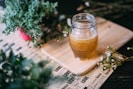 shallow focus photography clear glass jar on chopping board