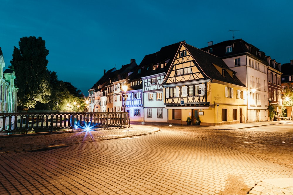 a cobblestone street at night in a european town