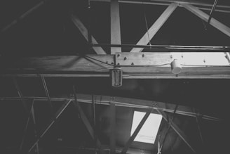 a black and white photo of a metal beam