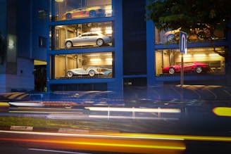 A rotating gallery slider showing a rare restored car, a drifting car in motion, and a high-end supercar.