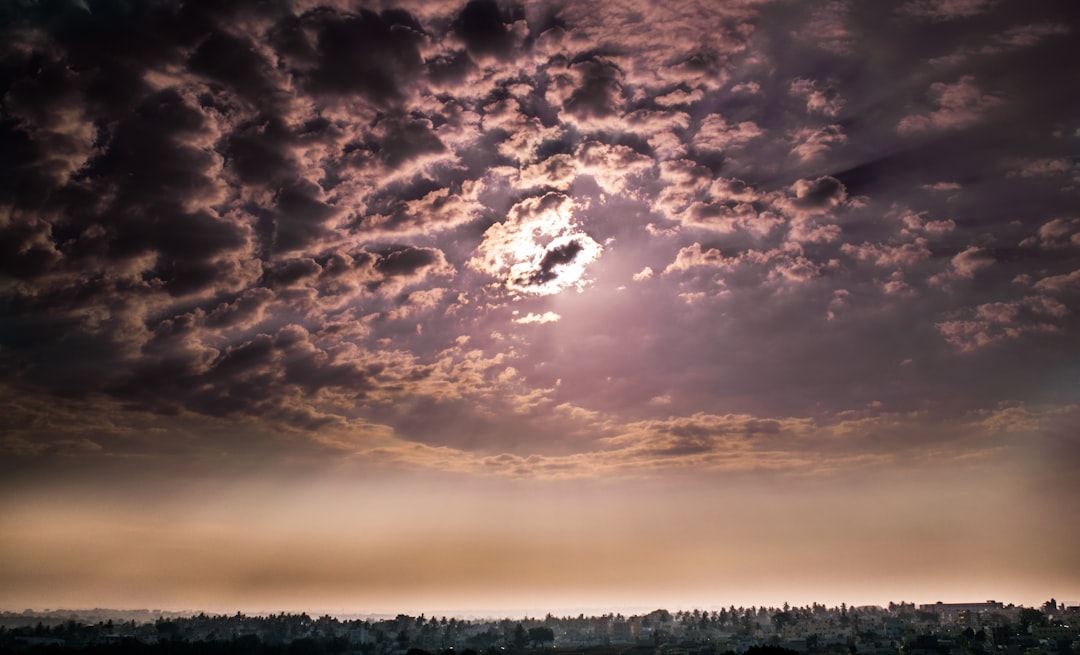 sun covered by cloudy sky