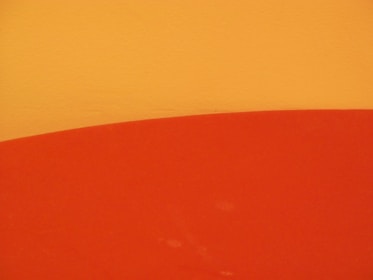 a close up of a surfboard on a wall