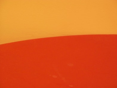 a close up of a surfboard on a wall