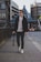 shallow focus photography of man holding DSLR camera