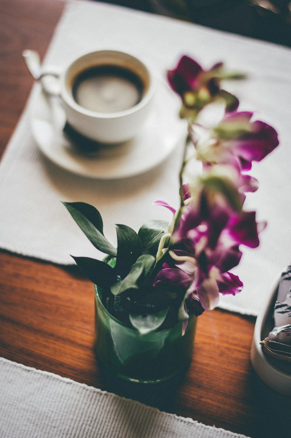 white ceramic mug on saucer