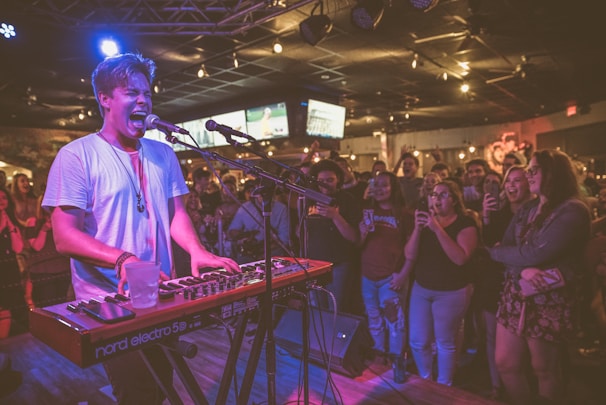 Sky Tero performing passionately on stage under vibrant lights at a Fullysyde Records event.