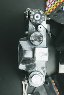 A close-up photo of a vintage camera with modern digital overlays.