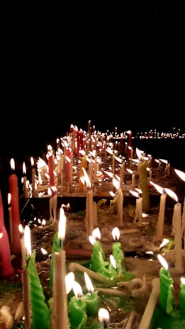 A cozy setting featuring mysticö candles in various colors.