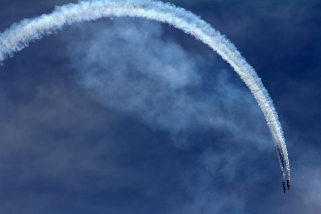 two jet fighters doing maneuver during daytime