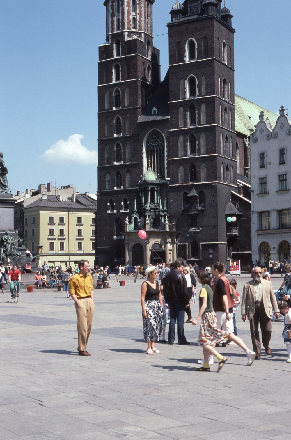 people standing beside concrete cathedral