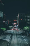 cars on gray asphalt road during nighttime