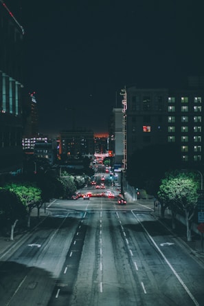cars on gray asphalt road during nighttime