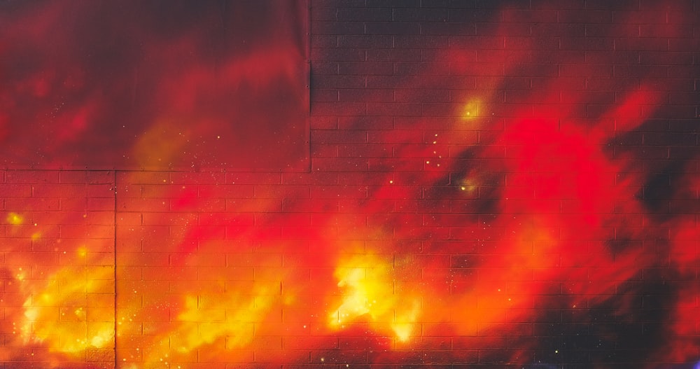 Une borne d'incendie devant un mur avec feu photo – Photo Las