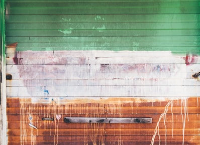 wooden wall with brown and green paint