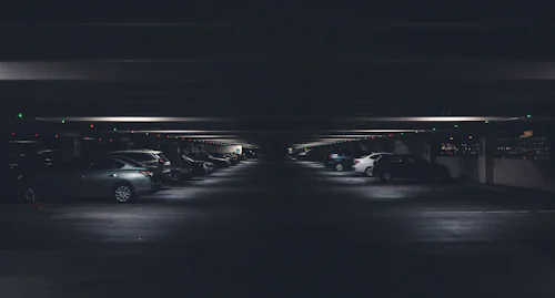 Car Park Management System — Rows of cars parked in a multi-level parking garage