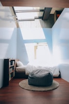 A bright and inviting bedroom decorated with Sky Home accessories.